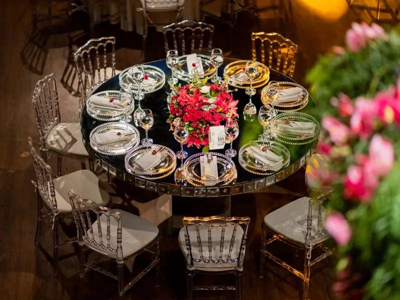 An elegant reception table set with linen and glassware