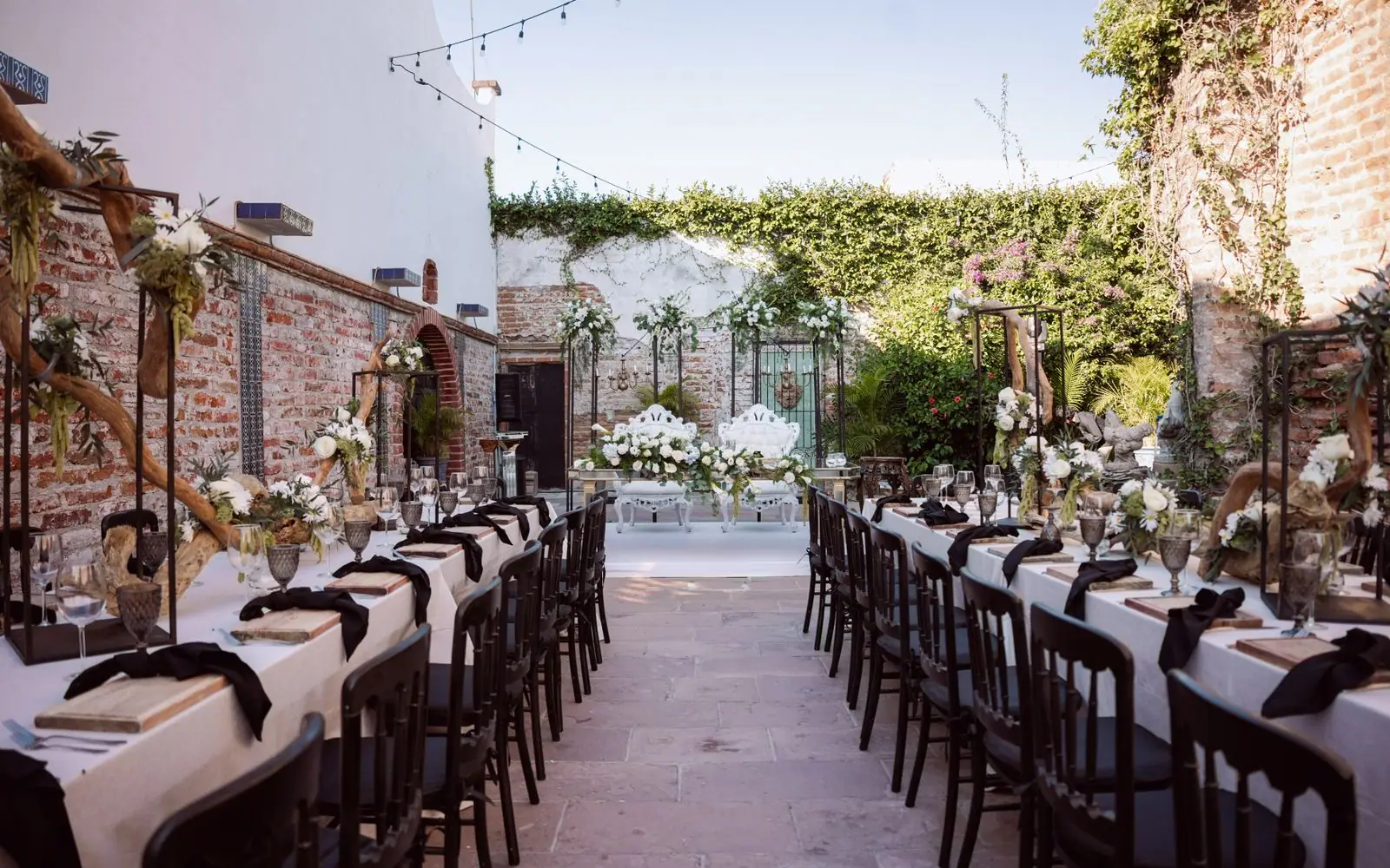 An outdoor reception laid out across the estate terrace